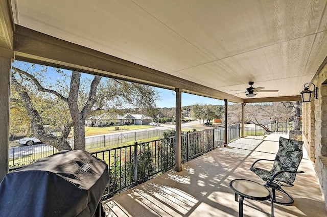 view of patio with a grill, a ceiling fan, and fence