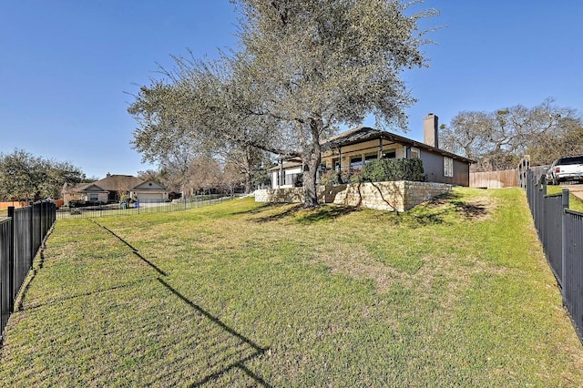 view of yard featuring a fenced backyard