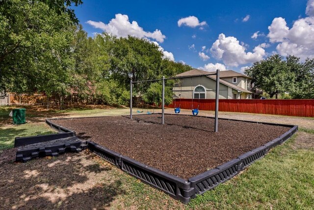 community jungle gym with fence