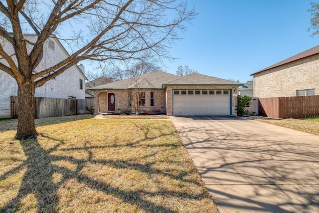 view of front of house with brick siding, a front lawn, fence, driveway, and an attached garage