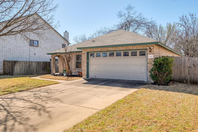 view of front of property featuring a garage, driveway, a chimney, and fence