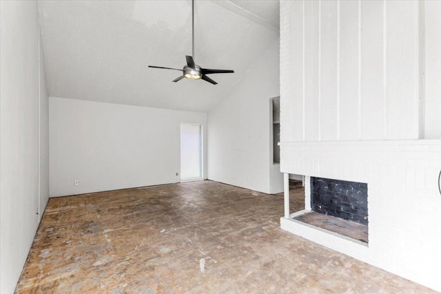 unfurnished living room with a fireplace, a ceiling fan, concrete floors, and lofted ceiling