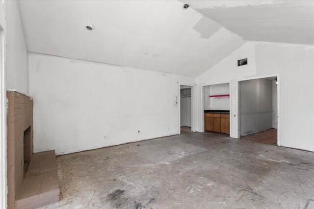 interior space with visible vents and high vaulted ceiling