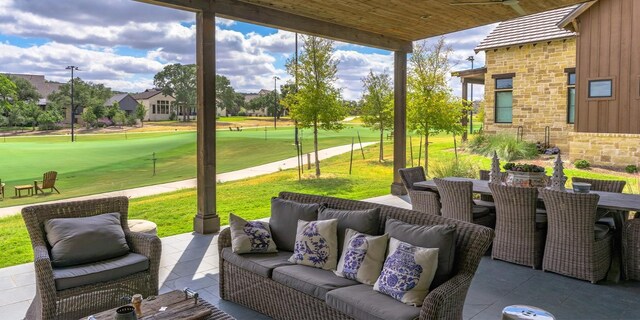 view of patio / terrace with outdoor dining space, an outdoor hangout area, and view of golf course