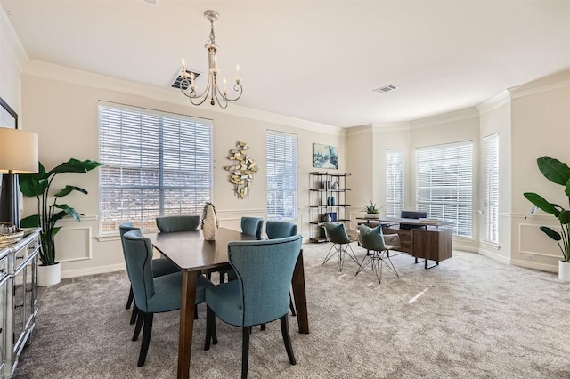 carpeted dining area featuring a wealth of natural light, visible vents, and ornamental molding