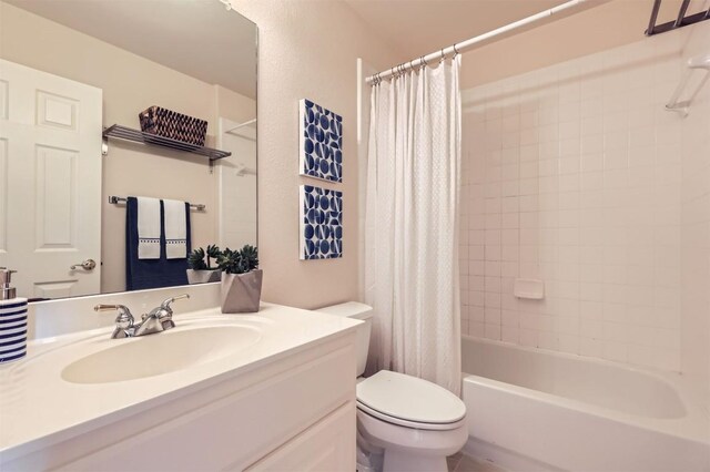 bathroom featuring toilet, vanity, and shower / bathtub combination with curtain