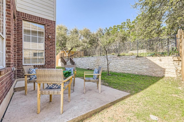 view of patio / terrace with an outdoor living space and a fenced backyard