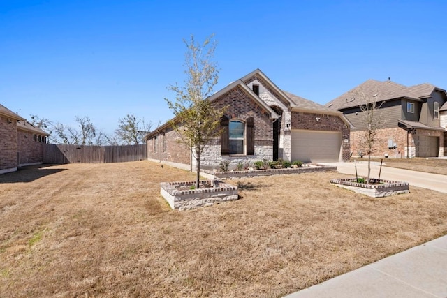 single story home with a front lawn, fence, concrete driveway, an attached garage, and brick siding