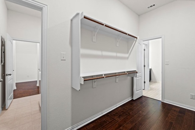 spacious closet featuring visible vents and hardwood / wood-style floors