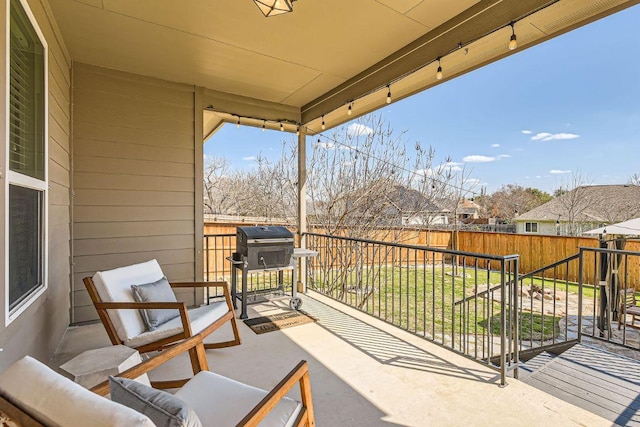 view of patio with an outdoor hangout area, area for grilling, and a fenced backyard