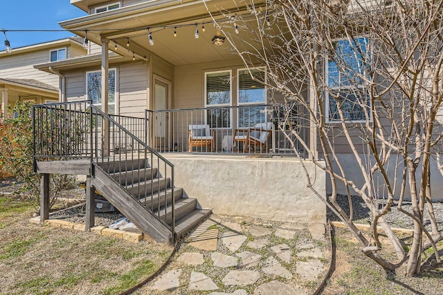 back of property with covered porch