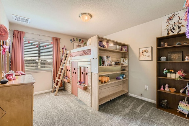 bedroom featuring baseboards, carpet, visible vents, and a textured ceiling