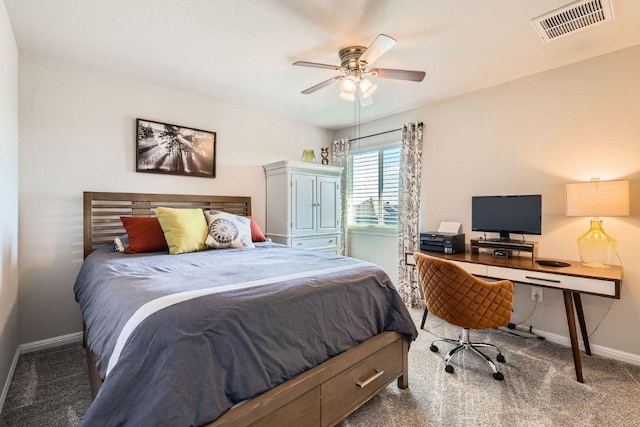 carpeted bedroom featuring visible vents, baseboards, and a ceiling fan