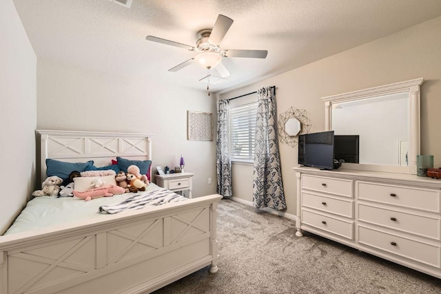 bedroom with light colored carpet, a textured ceiling, baseboards, and a ceiling fan