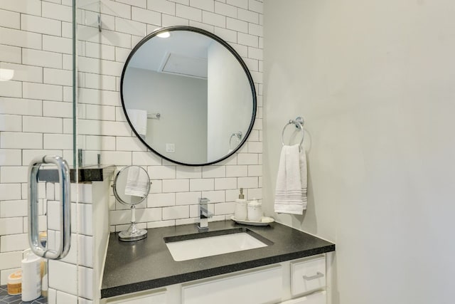 bathroom with tasteful backsplash and vanity