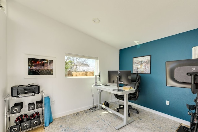 office with vaulted ceiling and baseboards