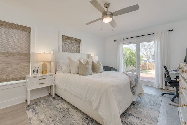 bedroom featuring light wood finished floors, a ceiling fan, and access to outside