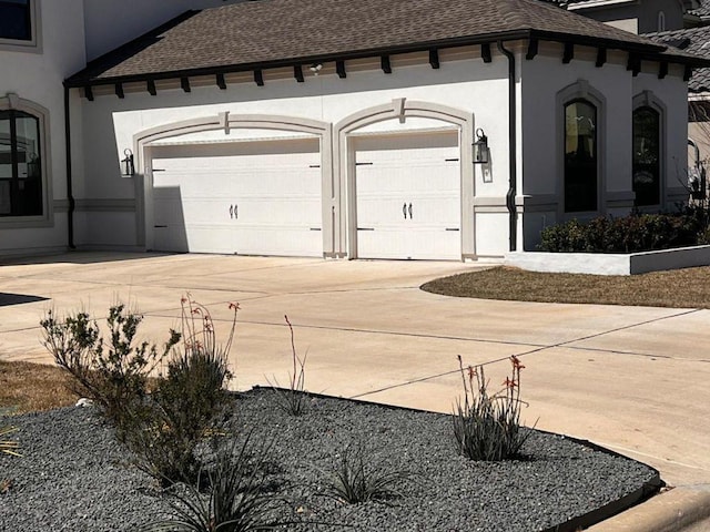 exterior space with concrete driveway