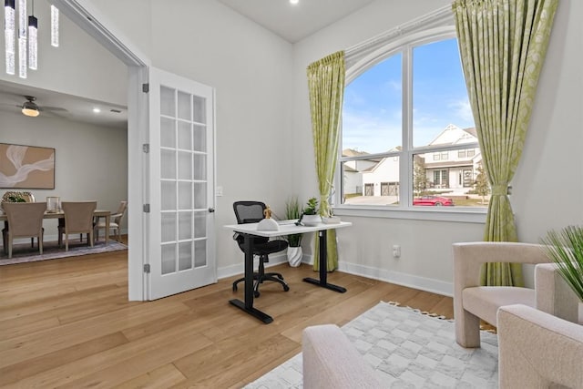 office featuring recessed lighting, light wood-type flooring, baseboards, and french doors