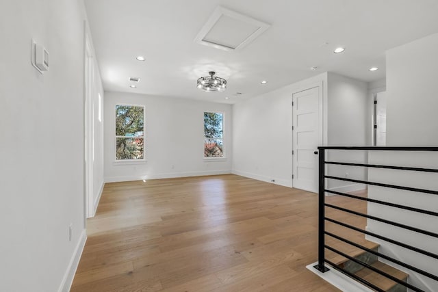 spare room with recessed lighting, visible vents, baseboards, and light wood-style floors