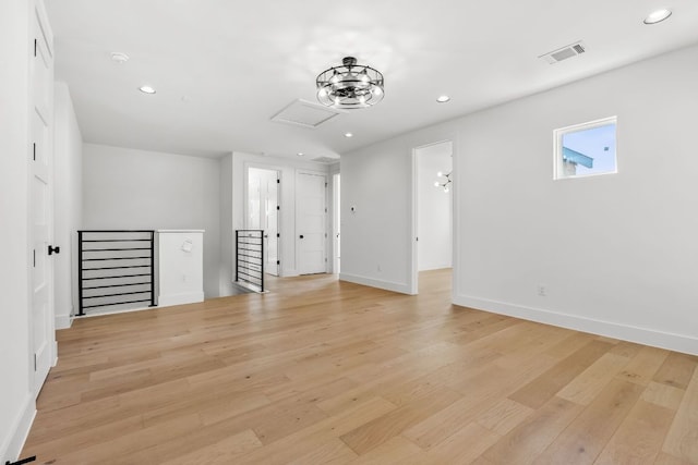 unfurnished living room with light wood-style flooring, recessed lighting, visible vents, and baseboards