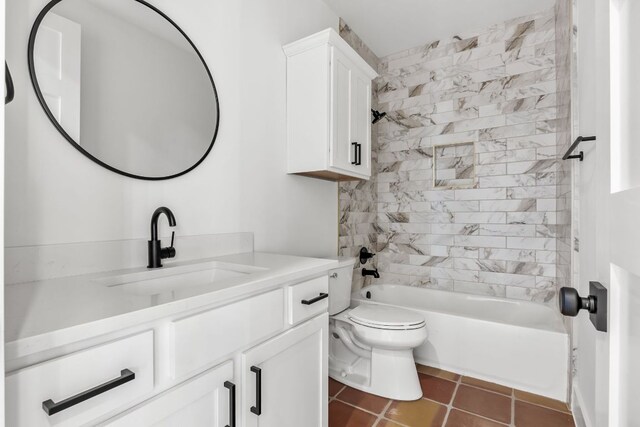 bathroom featuring toilet, shower / washtub combination, vanity, and tile patterned flooring