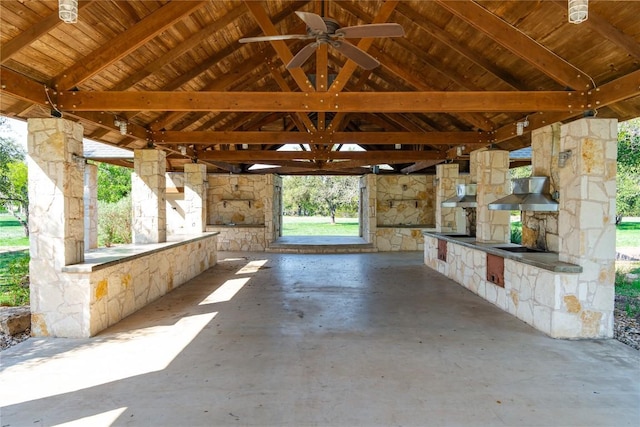 view of patio / terrace featuring a carport, ceiling fan, and a gazebo