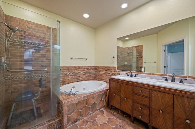 4229 Johns Light Dr, Austin, TX 78727 - bathroom with tile patterned flooring, a shower stall, a tub with jets, double vanity, and recessed lighting