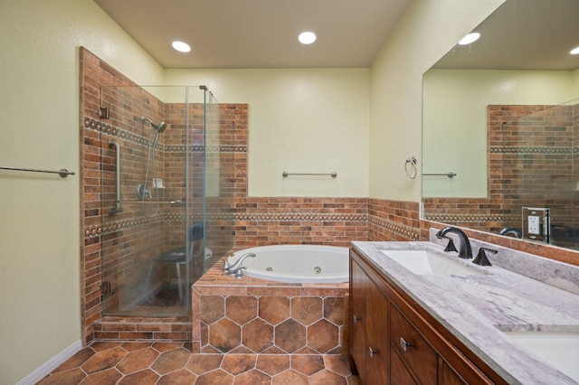 4229 Johns Light Dr, Austin, TX 78727 - full bathroom with a shower stall, a whirlpool tub, tile patterned floors, double vanity, and recessed lighting