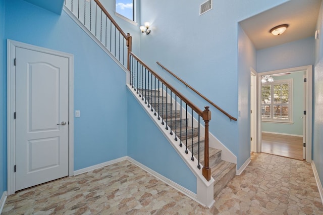4229 Johns Light Dr, Austin, TX 78727 - stairs with stone finish floors and baseboards