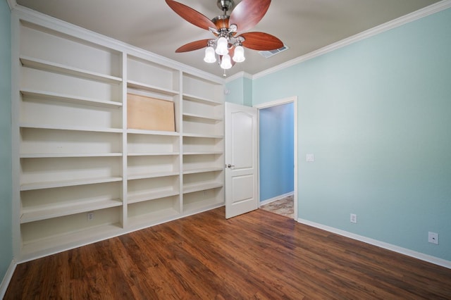 unfurnished bedroom with visible vents, ornamental molding, a ceiling fan, wood finished floors, and baseboards