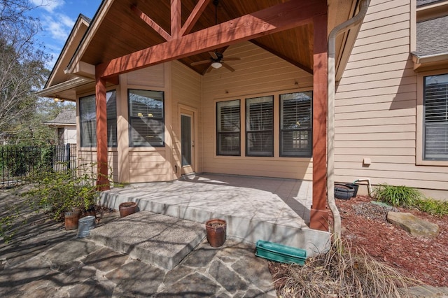 view of patio / terrace featuring fence and ceiling fan