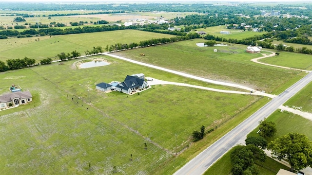 birds eye view of property featuring a rural view