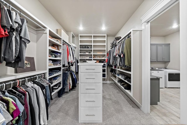 walk in closet featuring washer and clothes dryer