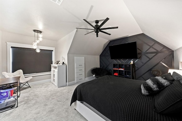 carpeted bedroom featuring lofted ceiling, visible vents, baseboards, and ceiling fan