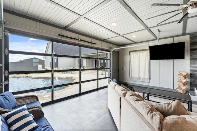 living area with a ceiling fan