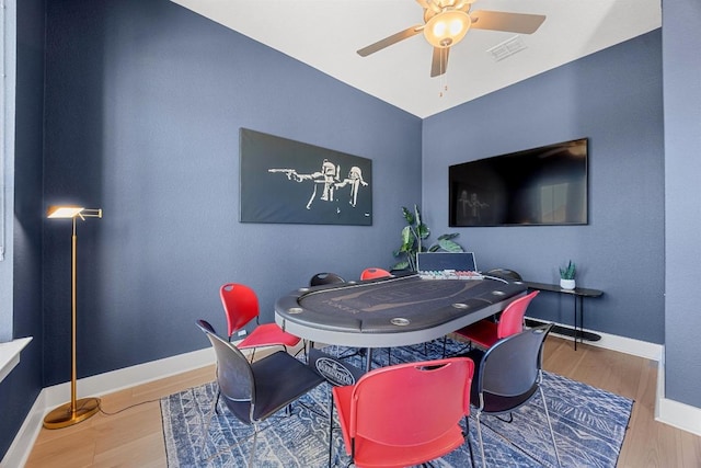 playroom with visible vents, wood finished floors, baseboards, and ceiling fan