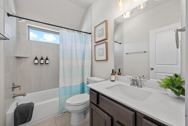 full bath with toilet, vanity, and shower / bath combo