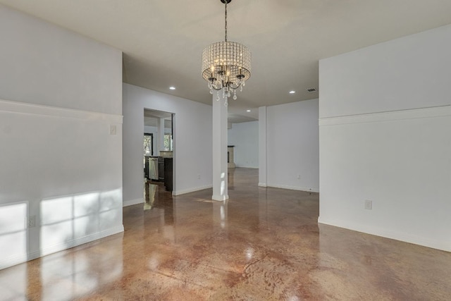 empty room featuring recessed lighting, baseboards, and a chandelier