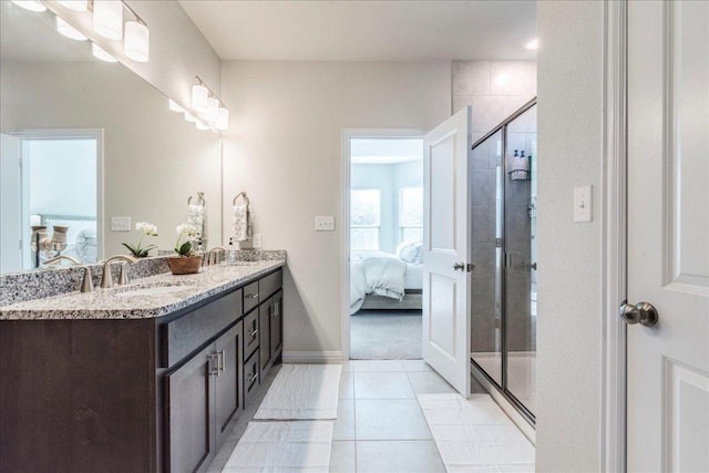 bathroom featuring ensuite bath, a stall shower, and a sink