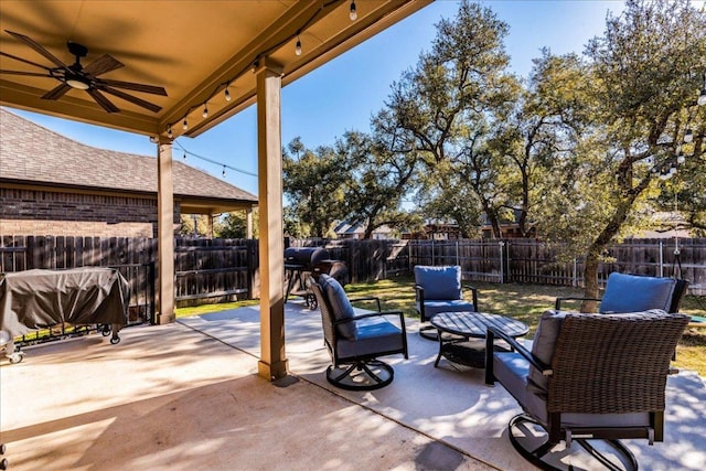 view of patio / terrace with ceiling fan, a grill, outdoor lounge area, and a fenced backyard