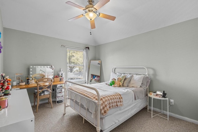 carpeted bedroom with baseboards, a ceiling fan, and vaulted ceiling