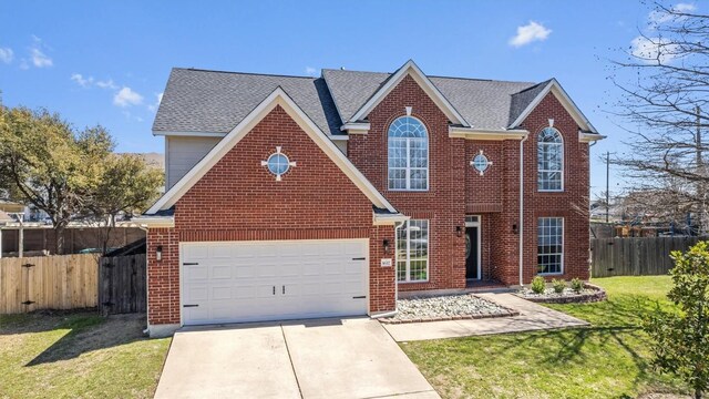 1617 Shady Hillside Pass, Round Rock, TX 78665 - traditional-style home with concrete driveway, brick siding, and roof with shingles