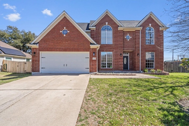 view of front of home with brick siding, fence, a front yard, a garage, and driveway