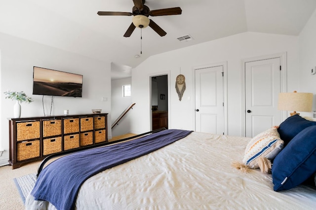 carpeted bedroom featuring visible vents, ceiling fan, and vaulted ceiling