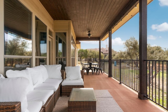 view of patio / terrace with outdoor dining space, an outdoor living space, and ceiling fan