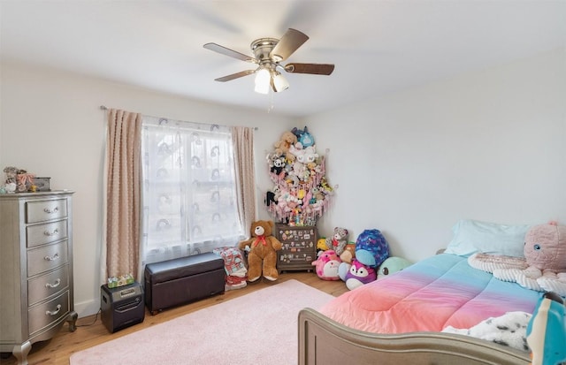 bedroom with ceiling fan and light wood-style floors