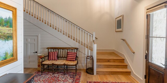 interior space featuring a healthy amount of sunlight, baseboards, and wood finished floors