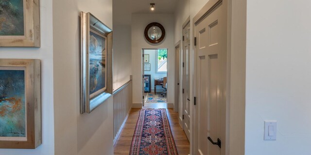 corridor featuring light wood-style floors