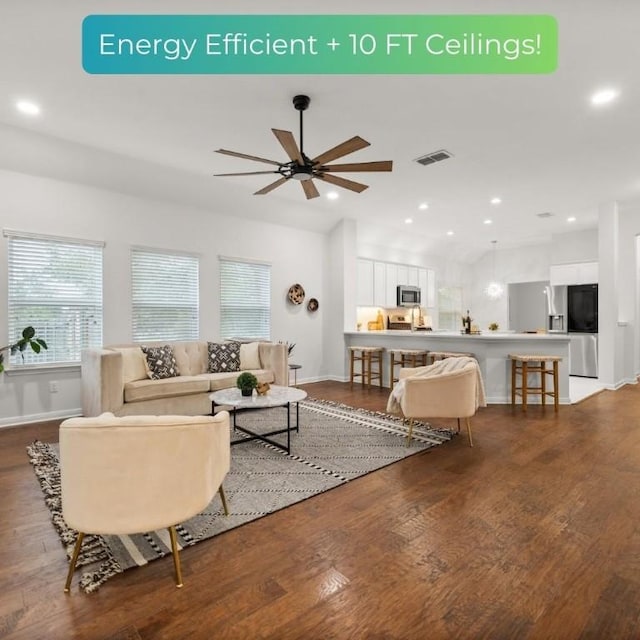 living area with a wealth of natural light, visible vents, wood finished floors, and recessed lighting